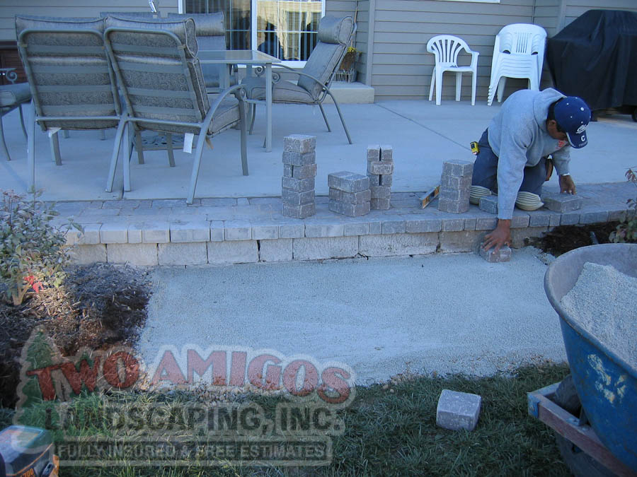 Laying brick pavers for patio border